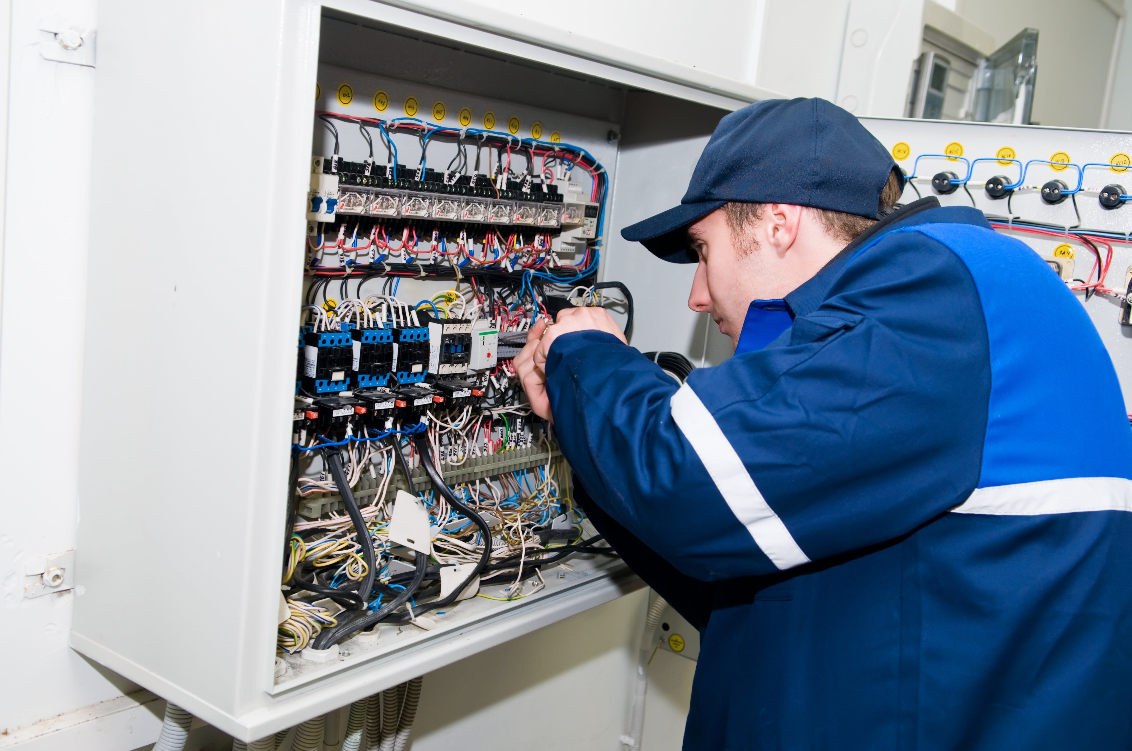 One Electrician Working On A Industrial Panel